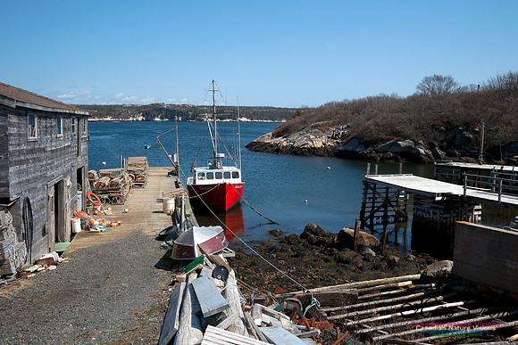 The Red Fishing Boat in the Cove